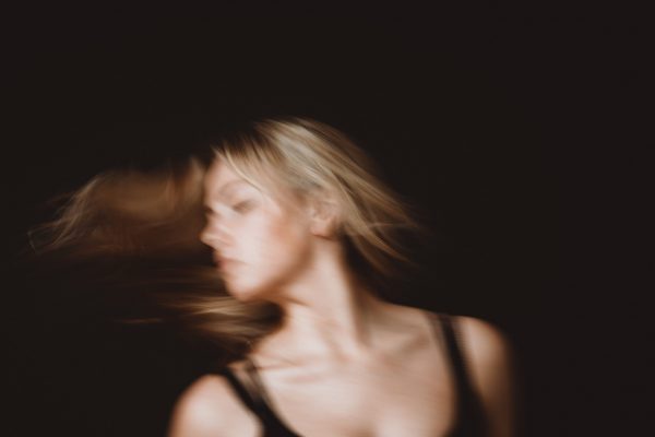woman-with-long-blond-hair-in-motion-blur